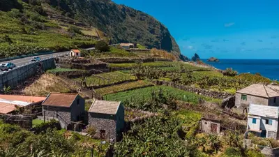 a village on a hill next to the ocean at GuestReady - Magical refuge in Madeira in Seixal
