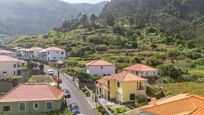 a small town with houses and a mountain at Casa Golino by YOUR KEY in São Vicente