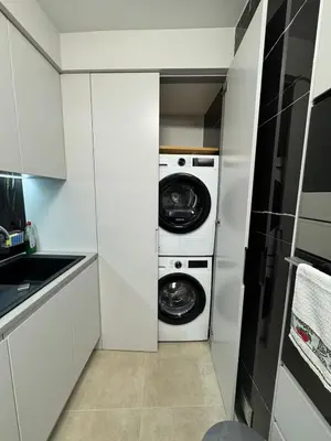 a kitchen with two washer and dryer in a room at Funchal Center Accomodation in Funchal