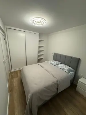 a bedroom with a bed in a white room at Funchal Center Accomodation in Funchal