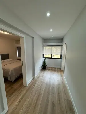 a bedroom with a bed and a wooden floor at Funchal Center Accomodation in Funchal