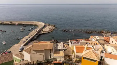 an aerial view of a harbor with boats in the water at No Stress House in Paul do Mar