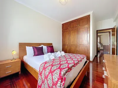 a bedroom with a bed and a wooden cabinet at Gaula Family Haven by Atlantic Holiday in Gaula