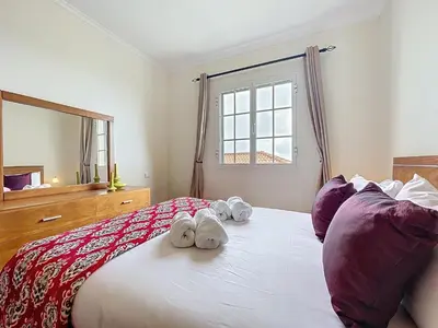 a bedroom with a bed with two stuffed animals on it at Gaula Family Haven by Atlantic Holiday in Gaula
