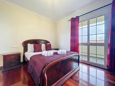 a bedroom with a bed with two towels on it at Gaula Family Haven by Atlantic Holiday in Gaula