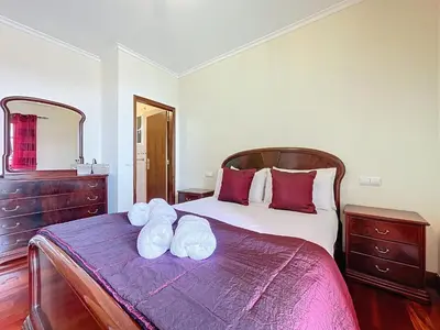 a bedroom with a bed with two towels on it at Gaula Family Haven by Atlantic Holiday in Gaula
