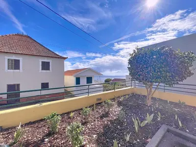 a tree on the balcony of a house at Gaula Family Haven by Atlantic Holiday in Gaula