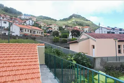 a view of a town with houses and mountains at Mocha House in Machico