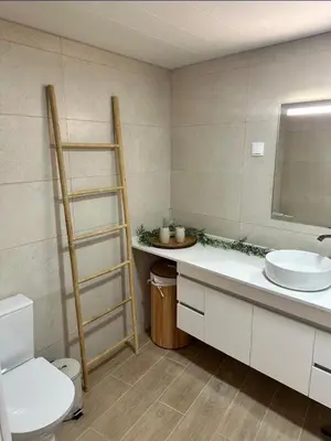 a bathroom with a sink and a toilet and a mirror at Mocha House in Machico