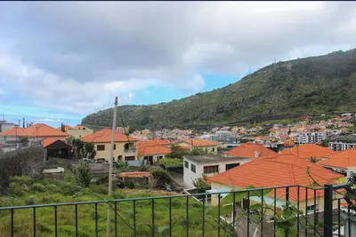 a view of a town with orange roofs at Mocha House in Machico