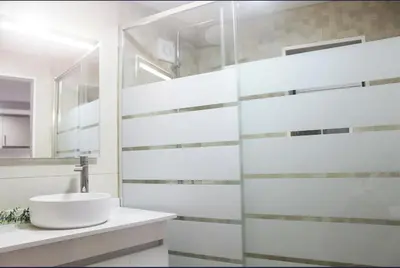 a bathroom with a sink and a mirror at Mocha House in Machico