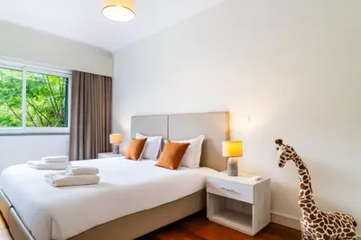 a bedroom with a bed with a giraffe on it at GuestReady - Exquisite stay with sea views in Calheta