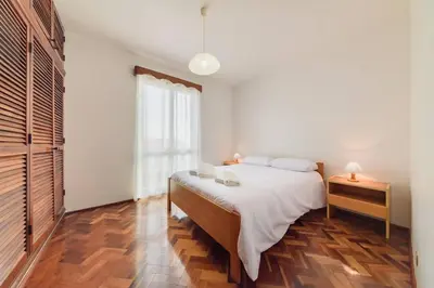 a bedroom with a bed and a dresser and a window at Casa do Massapez by Mth in Santa Cruz