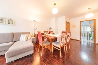a living room with a table and a couch at Apartamento Vieira by Mth in Campanário