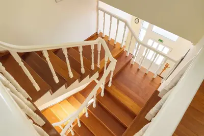 an overhead view of a staircase with wooden floors at Armando House Ocean View in Gaula
