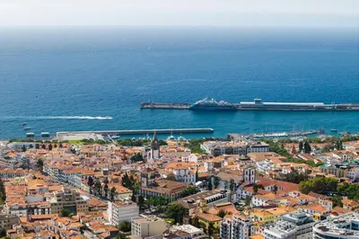 an aerial view of a city next to the ocean at Mar e Sol Chic & Modern City Apartment in Funchal