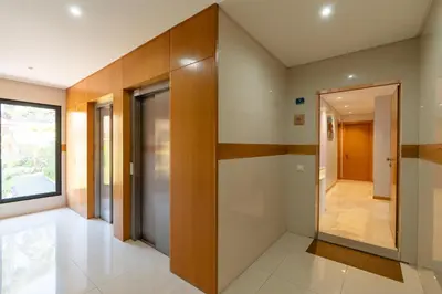 a hallway of a house with a door leading to a hallway at Mar e Sol Chic & Modern City Apartment in Funchal