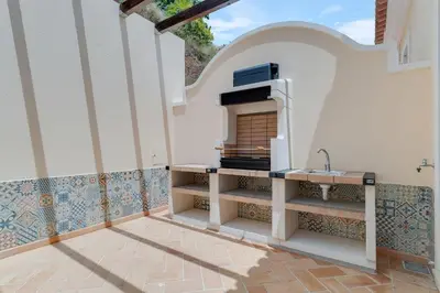 a kitchen with a sink and a counter top at Villa Sol Palheiro Village by Holiday Rental Madeira in Funchal