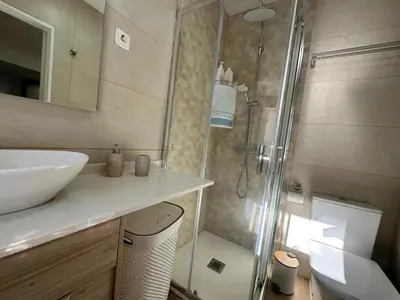a bathroom with a shower and a sink and a toilet at Mocha Studio in Machico