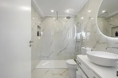 a white room with a bed and a window at Camacho Studios by Homie in Funchal