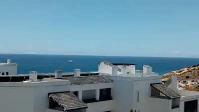 a white building with a view of the ocean at Sea View Apartment in Lagos