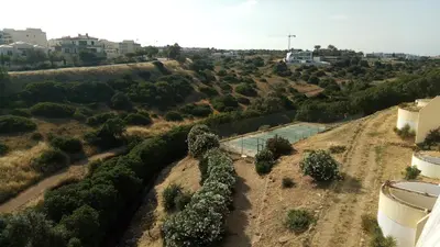 an aerial view of a yard with trees and a pool at Sea View Apartment in Lagos