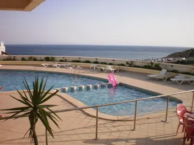 a swimming pool with a pink object in the water at Sea View Apartment in Lagos