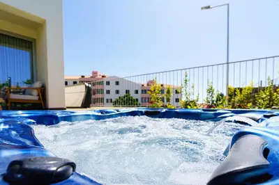 a jacuzzi plunge in a pool with water at Star Lit Jacuzzi Apartment in Câmara de Lobos