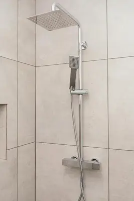 a shower with a shower head in a bathroom at Casa Piquita in Estreito da Calheta