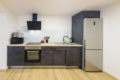 a kitchen with a refrigerator and a sink at Montana by Mth in Funchal