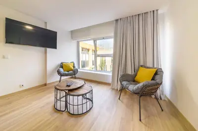 a living room with two chairs and a table at Montana by Mth in Funchal