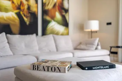 a book on a coffee table in a living room at Villa Mangoni - Brand New Luxury Villa in Funchal