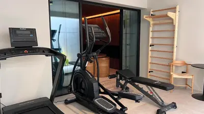 a room with a gym with a treadmill at Villa Mangoni - Brand New Luxury Villa in Funchal