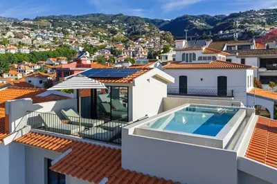 a view from the roof of a house with a swimming pool at Villa Mangoni - Brand New Luxury Villa in Funchal