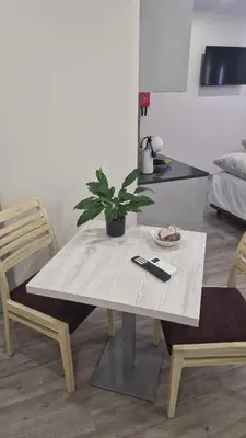 a table with a potted plant on it in a kitchen at Apartamento moderno no Funchal - Maracujá Apartment by Tropical Solutions in Funchal
