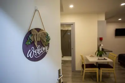 a dining room with a sign hanging on a wall at Apartamento moderno no Funchal - Maracujá Apartment by Tropical Solutions in Funchal