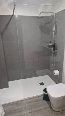 a bathroom with a glass shower with a toilet at Apartamento moderno no Funchal - Maracujá Apartment by Tropical Solutions in Funchal