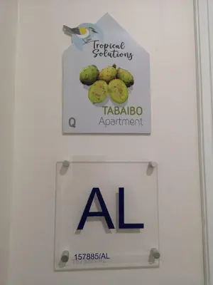 a sign on a door with a al sign on it at Apartamento moderno no centro do Funchal - Tabaibo By Tropical Solutions in Funchal