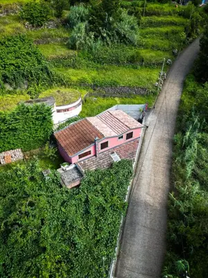 an aerial view of a house on a hill next to a road at Casa Do Senhor, By OP in São Vicente