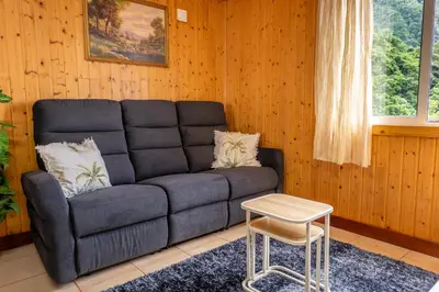 a living room with a couch and a table at Casa Do Senhor, By OP in São Vicente
