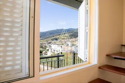 a window with a view of a city at Casa Lucas by Escape to Madeira in Arco da Calheta