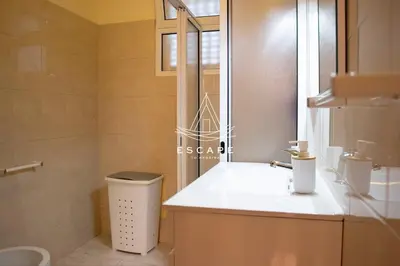 a bathroom with a white toilet and a sink at Casa Lucas by Escape to Madeira in Arco da Calheta