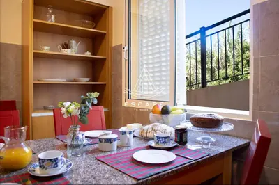a living room with a tv and a large window at Casa Lucas by Escape to Madeira in Arco da Calheta