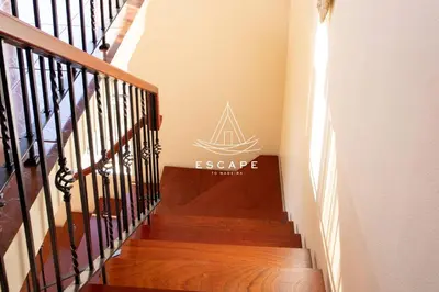 a living room with a couch in the middle at Casa Lucas by Escape to Madeira in Arco da Calheta