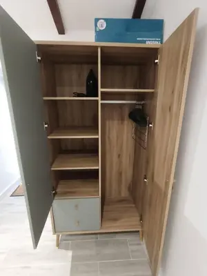 a bedroom with a bed and a dresser in it at Alojamiento Local - Estrela do Norte in Seixal