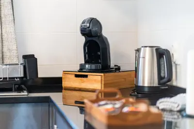 a kitchen with a coffee maker on a counter at GuestReady - Sea-View Retreat in Madeira in Funchal