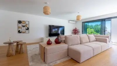 a living room with a couch and a table at Acqua Sensation Suites by LovelyStay in Funchal