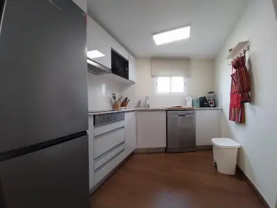 a bathroom with a shower and a sink and a mirror at Casa da Guiomarinha in Seixal