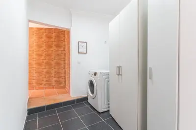 a laundry room with a washer and dryer at Stero House by Atlantic Holiday in Caniçal