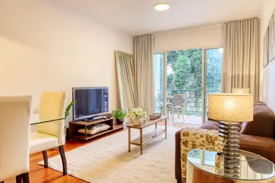 a living room with a couch and a tv at Alzira's Place, a Home in Madeira in Ponta do Sol